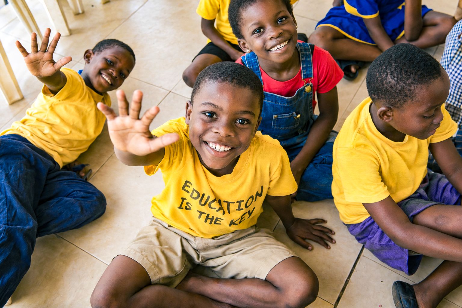 Ghanaian schoolchildren waving